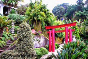 An exotic garden scene with a red pagoda