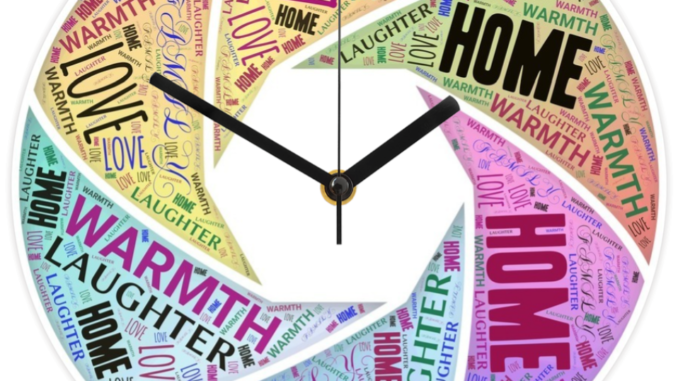 A round wall clock featuring word art created in a swirl with works that mean home such as warmth, laughter, etc.