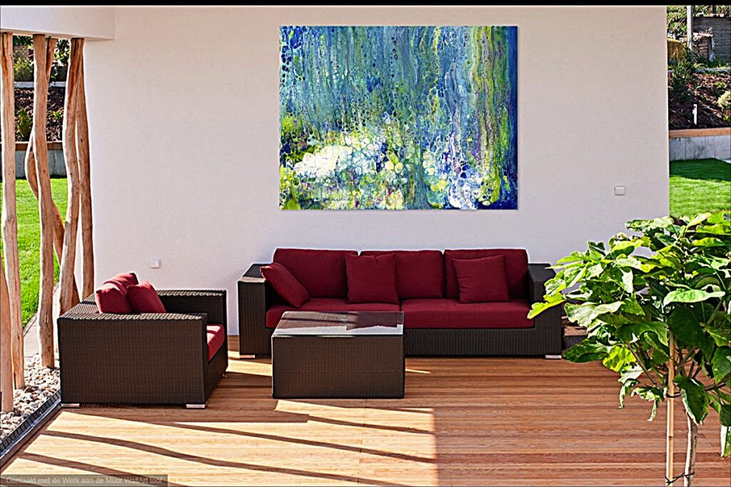 A sheltered outdoor area with burgundy and brown seating, coffee table and plant, has a large abstract painting in shades of blue, green, white and gold.